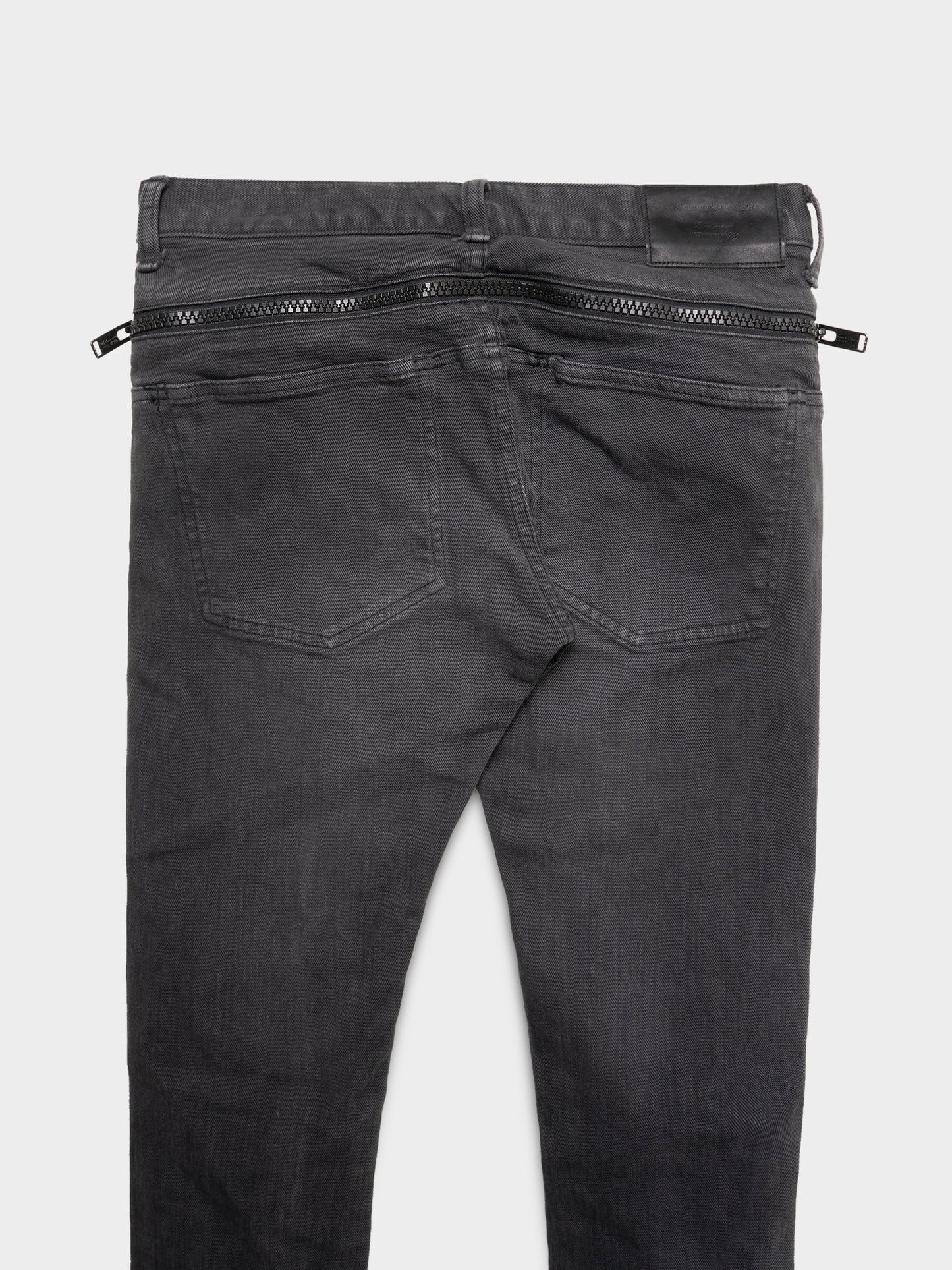 Ripped Knee Zip Jeans